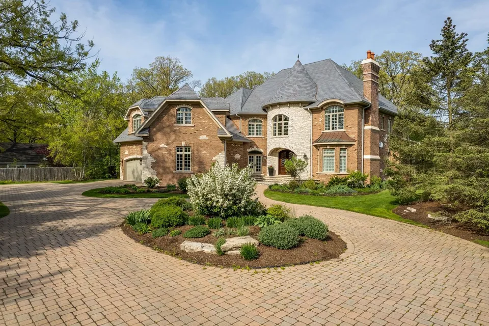 A grand estate, recomposed around its mature evergreens